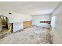 Living room showcasing tile floors and undergoing renovations at 23476 Harper Ave, Punta Gorda, FL 33980