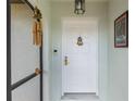 Inviting front entrance with decorative door details, hardware, and secure video doorbell at 26177 Madras Ct, Punta Gorda, FL 33983