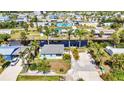 Stunning aerial view of waterfront home showcasing a canal front location and neighborhood at 4231 Hollis Ave, Port Charlotte, FL 33953