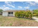 Inviting single-story home with manicured shrubbery in the front yard at 4282 Pocatella Ave, North Port, FL 34287
