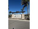 Elegant community sign with stone accents and lush landscaping, welcoming residents and visitors at 9474 Turtle Grass Cir, Punta Gorda, FL 33950