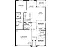 Detailed floor plan showcasing a three-bedroom home with open living spaces, a kitchen, and a two-car garage at 9474 Turtle Grass Cir, Punta Gorda, FL 33950