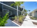 Screened in patios line the walking path with new greenery for each condo at 14271 Heritage Landing Blvd # 1516, Punta Gorda, FL 33955