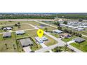 Expansive aerial view of the home's neighborhood and surrounding landscape, showcasing the property's location at 16031 Hesta Misty Ct, Punta Gorda, FL 33955