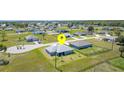 An aerial view of the home and neighborhood featuring a fenced-in backyard and spacious lots at 16098 Overdale Ct, Punta Gorda, FL 33955