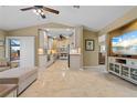 Open-concept living area featuring the kitchen with white cabinets, tile floors, and seamless access to a dining area at 2526 Rio Plato Dr, Punta Gorda, FL 33950