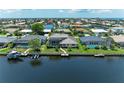 Waterfront home featuring a screened lanai, private dock, and stunning water views at 414 Caicos Dr, Punta Gorda, FL 33950
