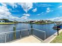 Scenic view of waterfront homes from a private dock, showcasing waterfront living at 414 Caicos Dr, Punta Gorda, FL 33950