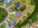 An aerial view showing the property lines of the house and surrounding greenery and waterfront at 501 Fairmont Ter, Port Charlotte, FL 33954