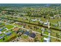 Stunning aerial view of a waterfront community with lush greenery and canal access at 69 Bunker Rd, Rotonda West, FL 33947