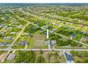 Beautiful aerial view of the home's location, showcasing the community, nearby canals, and lush greenery at 111 Britt Rd, Rotonda West, FL 33947