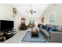 Spacious living room features vaulted ceilings, tile floors, and ample natural light at 12185 Weimar Ave, Port Charlotte, FL 33981