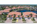 Community of well-maintained townhomes with lush landscaping and private docks, creating a luxurious waterfront living experience at 143 Tropicana Dr # 1012, Punta Gorda, FL 33950