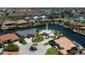 An aerial view of canal-front homes showcases the waterfront community at 1435 Pine Island Ct, Punta Gorda, FL 33950