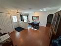 Cozy dining room featuring hardwood floors, elegant table setting, and ample natural light at 1505 Kenmore St, Port Charlotte, FL 33952