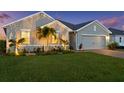 Beautiful home featuring a manicured lawn and mature landscaping at 16032 Galiano Ct, Punta Gorda, FL 33955