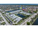 An aerial view highlighting the community's waterfront location, canal access and amenities at 2521 W Marion Ave # 912, Punta Gorda, FL 33950