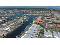 Aerial view showcasing waterfront property with dock, canal access and boat parking at 2521 W Marion Ave # 912, Punta Gorda, FL 33950