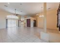 Expansive living room with tile flooring, large windows, and a seamless flow into other areas of the home at 25538 Rampart Blvd, Punta Gorda, FL 33983