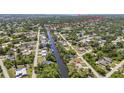 Expansive aerial shot displays the residential community along a waterway leading to the bay at 2626 Auburn Blvd, Port Charlotte, FL 33948