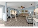 Bright, light-blue living room showcasing modern flooring, neutral furniture, and comfortable seating at 3225 Magnolia Way, Punta Gorda, FL 33950