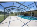 Beautiful screened-in pool with ample patio space and inviting blue water at 1039 Marlene St, Port Charlotte, FL 33952