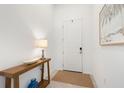 Bright foyer with console table, decor, and a neutral color palette at 1734 Saddlewood Cir, Port Charlotte, FL 33953