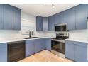 Well-lit kitchen with a black sink, updated appliances, and granite countertops at 2420 Linton Ln, Port Charlotte, FL 33952
