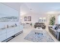 Well-lit living room featuring modern decor, comfortable seating, and an open layout at 25379 Paladin Ln, Punta Gorda, FL 33983