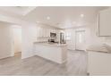 Modern, open kitchen featuring stainless steel appliances and white cabinets at 27128 Aloha Dr, Punta Gorda, FL 33955