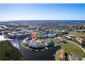 An aerial shot of a home in a beautiful waterfront neighborhood with a private marina at 3256 White Ibis Ct # 24A, Punta Gorda, FL 33950