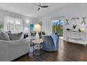 Comfortable living room featuring stylish furniture, wood flooring and natural light at 3616 Allapatchee Dr, Punta Gorda, FL 33950