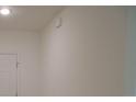 Neutral wall with a white door and ceiling light at 4830 Cazes Ave, North Port, FL 34287
