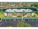 Exterior of waterfront condos with covered parking and lush landscaping creating a serene coastal living environment at 601 Shreve St # 21C, Punta Gorda, FL 33950
