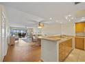 Bright and airy living room with views of the lanai, creating a seamless indoor-outdoor living experience at 601 Shreve St # 21C, Punta Gorda, FL 33950