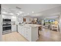 Bright kitchen features granite countertops, stainless steel appliances and tile flooring at 601 Shreve St # 53C, Punta Gorda, FL 33950