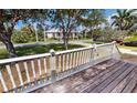 Inviting front porch with wooden railings and a view of the surrounding neighborhood at 1250 Lemon St, Punta Gorda, FL 33950