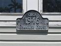 Close up of a sign noting the Chandler House built circa 1946 at 1250 Lemon St, Punta Gorda, FL 33950