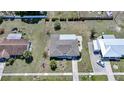 Aerial view of a well maintained home featuring a new roof, nice landscaping and close proximity to neighbors at 2166 Beacon Dr, Port Charlotte, FL 33952