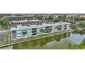 Waterfront condo complex featuring balconies and easy access to the water and scenic views at 2486 Caring Way # 14A, Port Charlotte, FL 33952