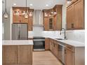 Well-equipped kitchen boasts stainless steel appliances, stylish cabinetry, and ample counter space at 4862 Kiska Rd, North Port, FL 34288