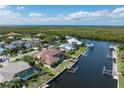 Waterfront property with access to a private dock, pool, and outdoor entertainment at 5023 Key Largo Dr, Punta Gorda, FL 33950