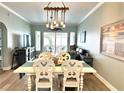 Inviting dining area featuring seating for four and open views to the waterfront facing balcony at 5114 Melbourne St # A302, Punta Gorda, FL 33980