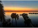 Scenic sunset overlooking the tranquil waterfront with a fishing pier for residents and guests at 5114 Melbourne St # A302, Punta Gorda, FL 33980