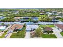 View of a waterfront community and beautiful landscaping and canals at 9582 Arsipe Cir, Port Charlotte, FL 33981