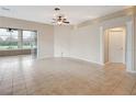 Bright living room featuring decorative columns, tile floors, and neutral paint at 10263 Shadow Run Cir, Punta Gorda, FL 33955