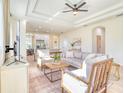 Bright living room featuring a coffered ceiling, neutral colors and an open floor plan at 122 Arrow Ln, Rotonda West, FL 33947
