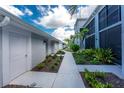 Inviting exterior view showcasing a beautifully landscaped walkway leading to a condo entrance at 14257 Heritage Landing Blvd # 1115, Punta Gorda, FL 33955
