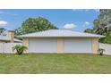 Three-car garage detached from the main house, offers ample parking and storage space at 1761 Okolona St, North Port, FL 34287