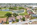 Aerial view of the community showcasing homes with a golf course and ponds at 1876 Birmingham Blvd, Punta Gorda, FL 33980